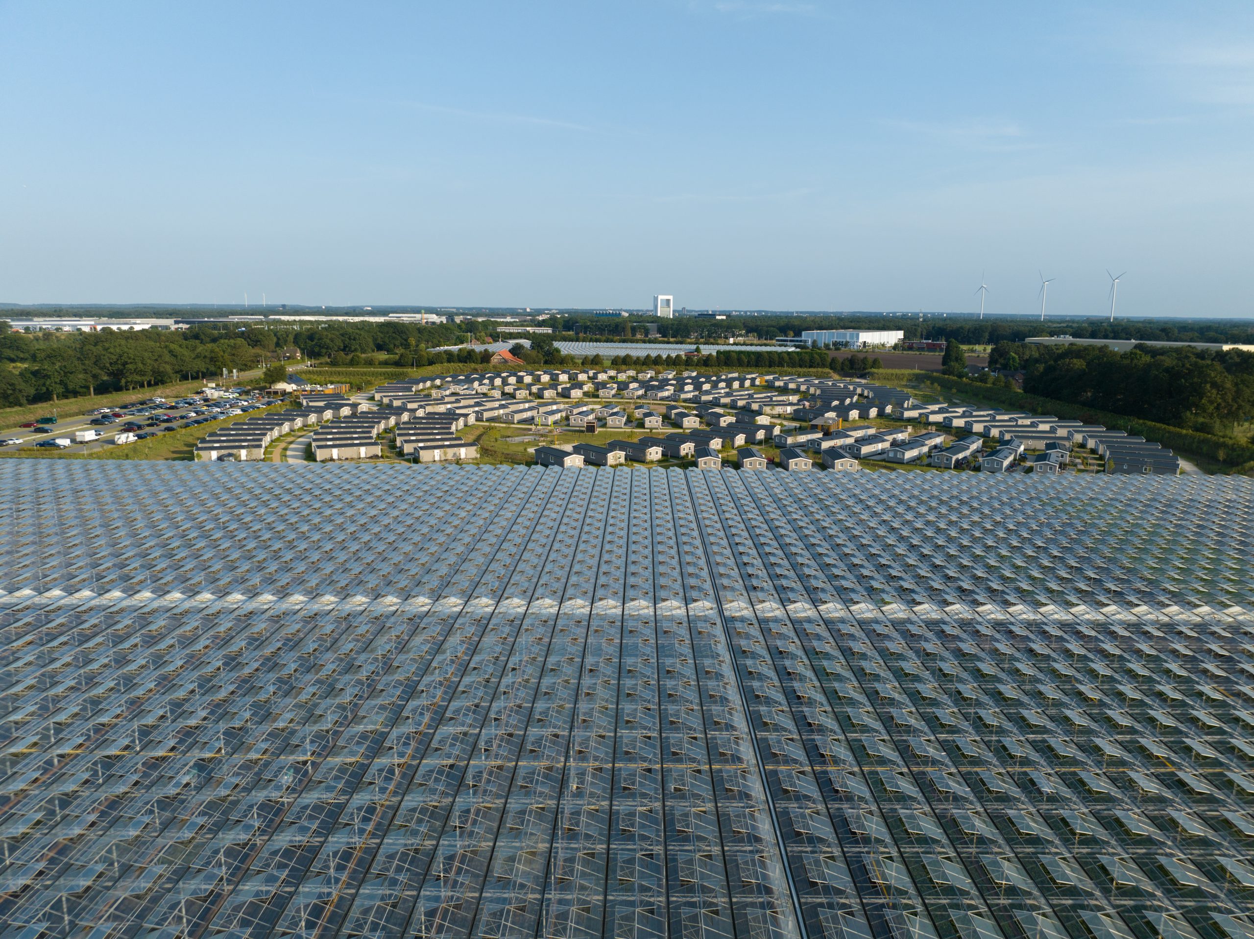 Workers housing next a greenhouse and on industrial business park. Workers migration, aerial drone photo. Venlo, The Netherlands.
